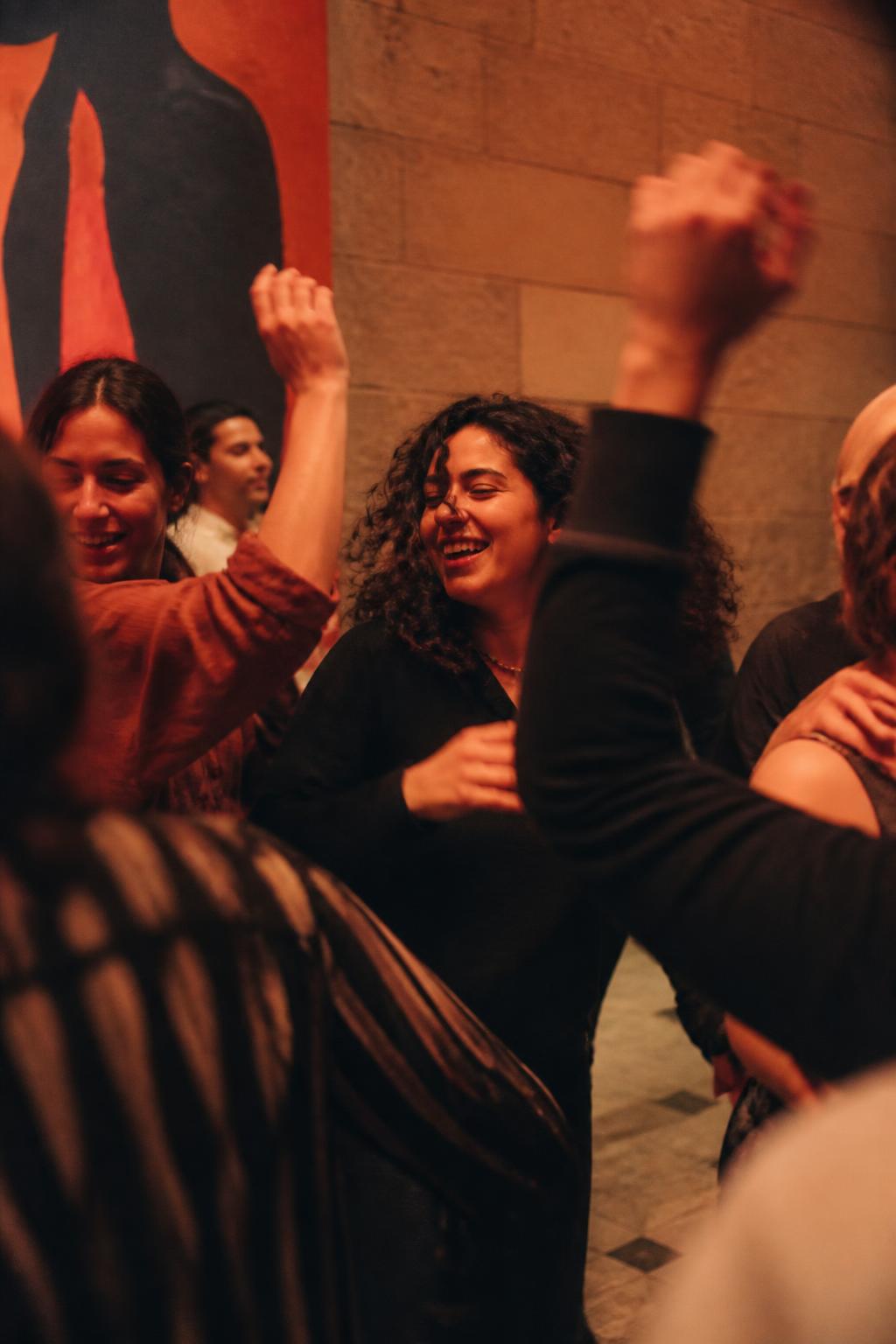 Friends dancing freely together without cameras