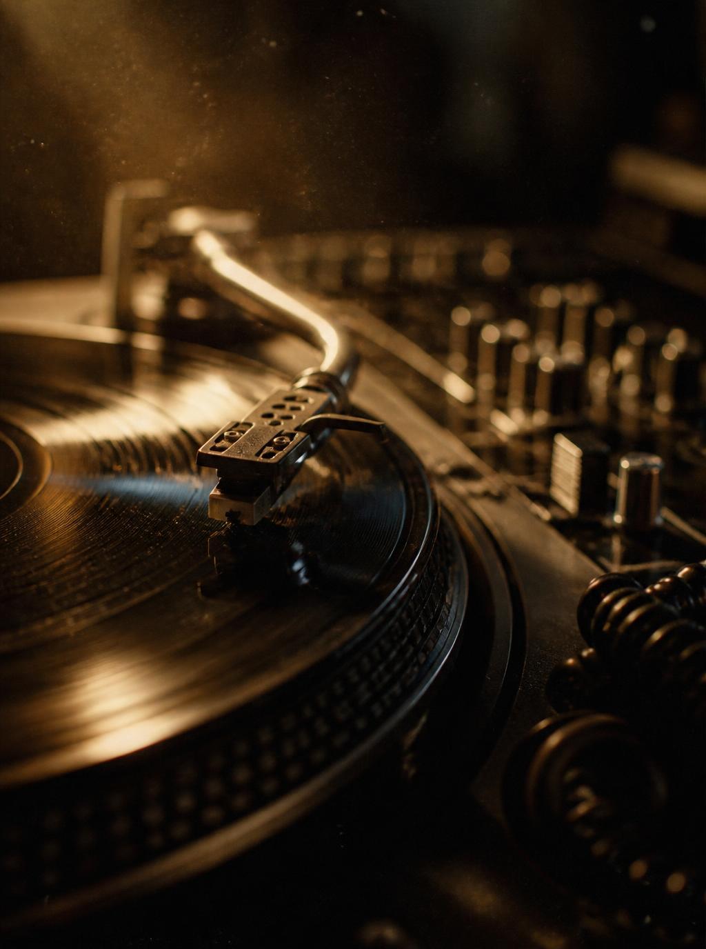 Close-up of a turntable tonearm on a record in warm light